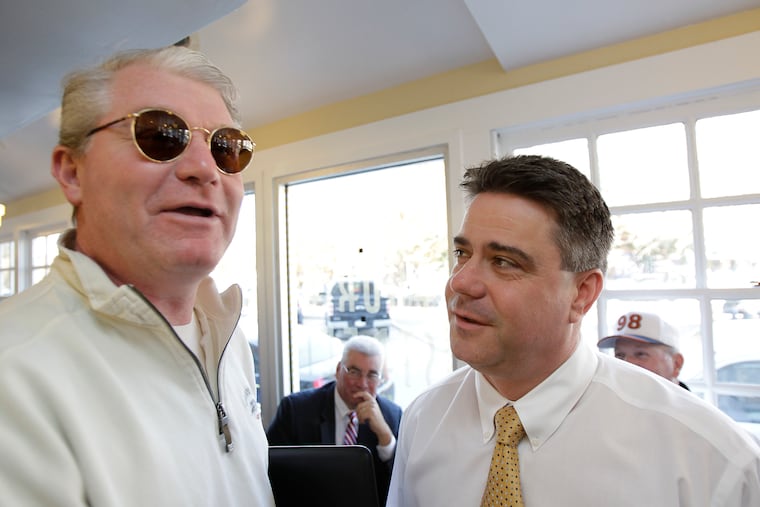 John Dougherty, left, and Bobby Henon, right, talk at Famous 4th Street Deli on Election Day in 2011.