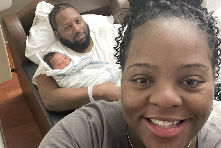 Rodney cuddles his namesake, Rodney, Jr., while an ebullient post-partum Myna snaps a selfie.