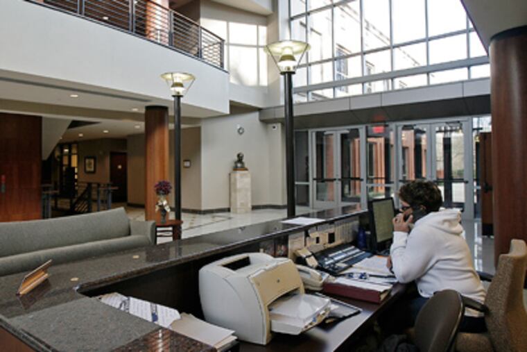 The reception desk at Radnor's new municipal building. To recoup some
of the costs of the project, the township is renting out some space. (Akira Suwa / Staff Photographer)