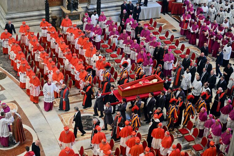 The body of Pope Francis is carried into St. Peter's Basilica at the Vatican on Wednesday, April 23, 2025, where he will lie in state for three days.