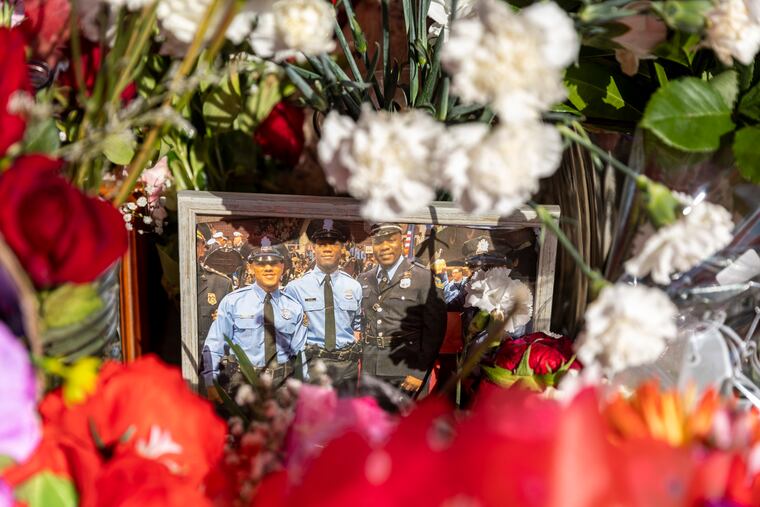 A memorial for Temple University Police Officer Christopher Fitzgerald at the corner of 17th and Bouvier Street, near the place he was killed on Saturday.