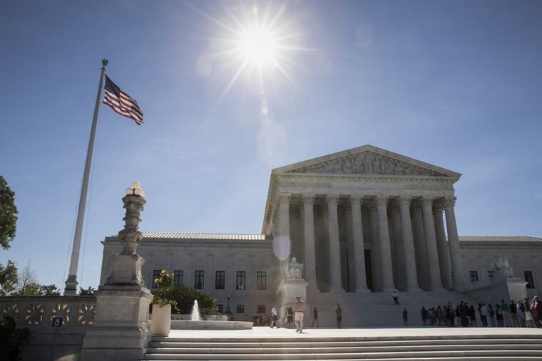 People visit the Supreme Court as justices issued their final rulings for the term on Monday.