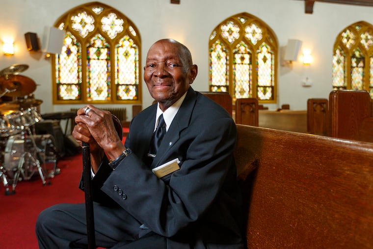 Clarence Walker, 97, is an usher for Sunday services at Holy Cross Baptist Church in Overbrook and a World War II veteran.