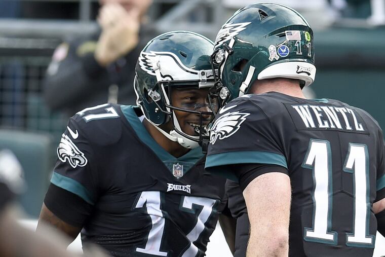 Alshon Jeffery and Carson Wentz celebrate a touchdown in a November game. You can win tickets to an Eagles game through the Philadelphia Youth Sports Collaborative.