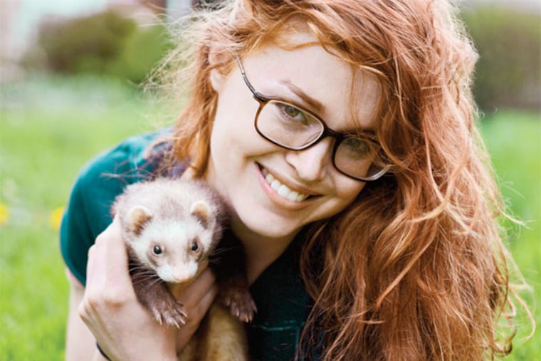 Emily Kight and her pet ferret Moca.