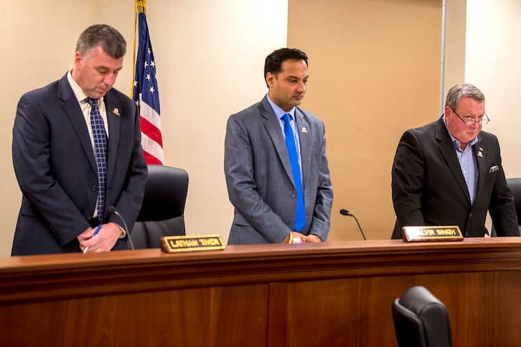 Burlington County Freeholder Latham Tiver (left), Freeholder Deputy Director Balvir Singhand (center) and Freeholder Director Tom Pullion (right) standing for a prayer at the beginning of a meeting in January of 2019.