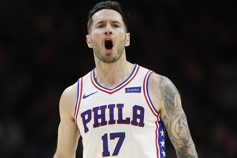 Sixers guard JJ Redick yells after making a late fourth-quarter three-point basket against the Los Angeles Clippers on Saturday, February 10, 2018 in Philadelphia.