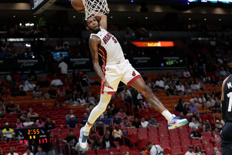 Derrick Jones lays in a huge alley-oop dunk during the Heat's loss to the Raptors on Sunday in Miami.