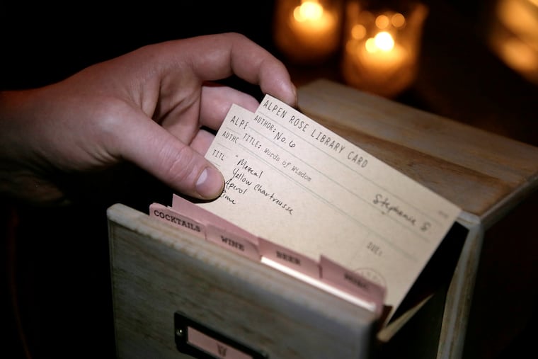 The card catalogue with drinks customized and numbered for regulars sits on the bar at Alpen Rose.