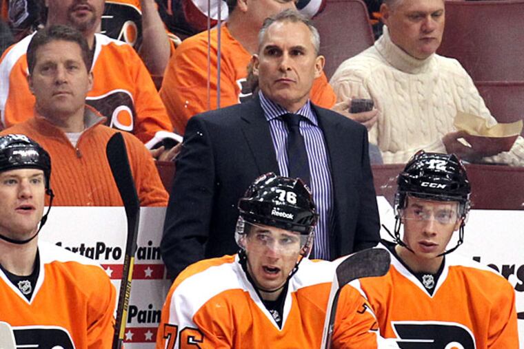 Craig Berube watches his team play the Nashville Predators on Thursday, January 16, 2014. (Yong Kim/Staff Photographer)