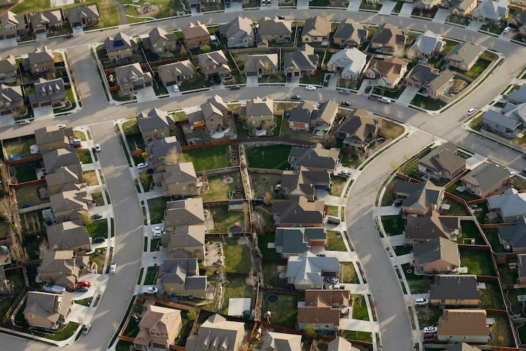 This April 2019 photo shows homes in suburban Salt Lake City.