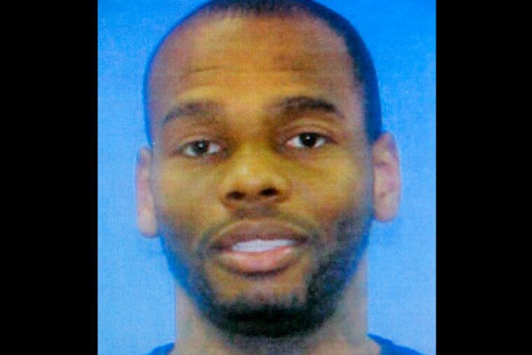 Gerald "Skip" Murphy, 38, is seen in this photograph provided by the Mercer County Prosecutor's Office in Trenton, N.J., Sunday, May 12, 2013. Three children are safe after a 36-hour standoff with Murphy, who was armed, ended early Sunday, in Trenton, N.J., state law enforcement officials said. Murphy was killed during the rescue, officials said. But the bodies of a woman, presumed to be homeowner Carmelita Stevens, 44 -- the mother of the children -- and a young boy, presumed to be her 13-year-old son, were found decomposing in the home. (AP Photo/Mel Evans)