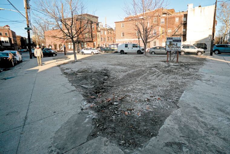 Now filled, the lot at what was known as Triangle Park in Bella Vista. Excavators were about a foot from reaching pollutants. ( TOM GRALISH / Staff Photographer )