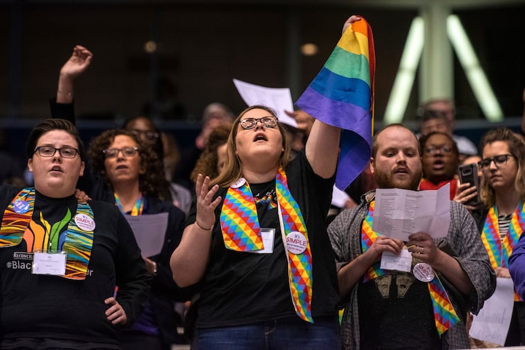 Shelby Ruch-Teegarden (center) of Garrett-Evangelical Theological Seminary joins other protestors during the United Methodist Church's special session of the general conference in St. Louis in February 2019.