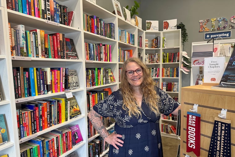 Owner Kelley Hartnett poses at her Double Dog Bookshop in Wentzville, Mo., on Wednesday, May 27, 2026. "People are craving connection, especially in-person connection,” she said. “People are over the internet and virtual meetings and algorithms."