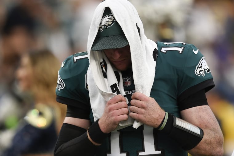 Philadelphia Eagles quarterback Carson Wentz leaves the field during the second half of an NFL football game against the Los Angeles Rams Sunday, Dec. 10, 2017, in Los Angeles.(AP Photo/Kelvin Kuo)