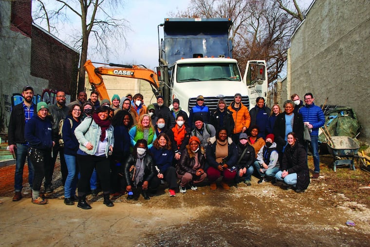 Members of the Habitat for Humanity Philadelphia staff posed for a photo at a groundbreaking for a home in Germantown earlier this month. MacKenzie Scott's $5 million gift to the nonprofit this year is its largest to date.