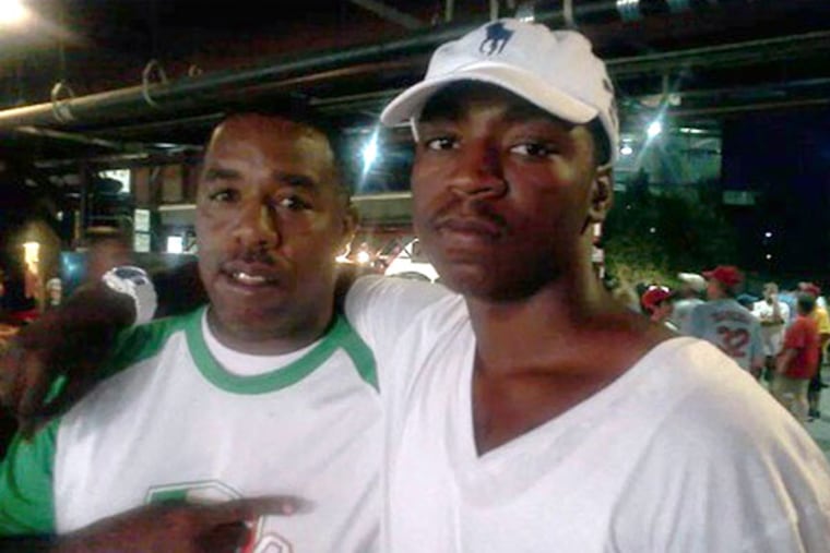 Troy Smith (left) and his son, Troy K. Smith Jr. who was shot and killed on June 7. His parents are holding a march this Saturday in hopes of bringing awareness to help catch the killer. (Courtesy photo)