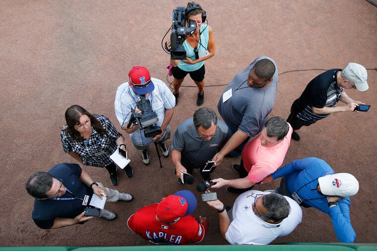Phillies manager Gabe Kapler (bottom), here meeting with the media earlier in spring training, vows to be more candid in his second season.