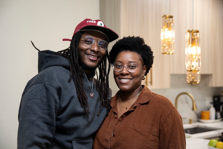 Stefan Walrond and Mercedes Murphy pose at their Port Richmond home on Tuesday, Jan. 13, 2026, in Philadelphia.