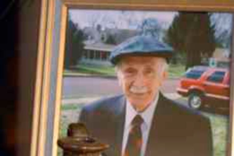 The Edgefield face jug and a photo of Robert Strang, who unearthed it in 1950 on land once owned by an abolitionist.