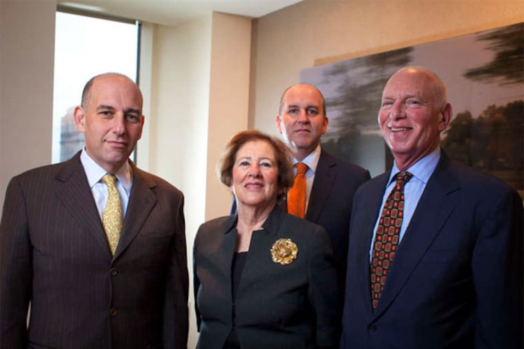Two generations of Cohen family entrepreneurs: (from left) Daniel Cohen, mother Betsy Z. Cohen, Jonathan Cohen, and father Edward E. Cohen in their Rittenhouse Square offices. (Ed Hille / Staff Photographer)