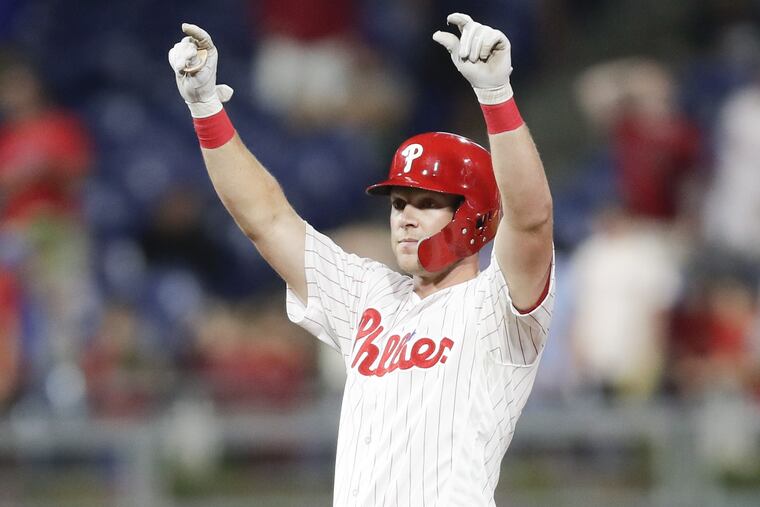 Phillies outfielder Rhys Hoskins raising his arms after hitting a double against the Dodgers last week.