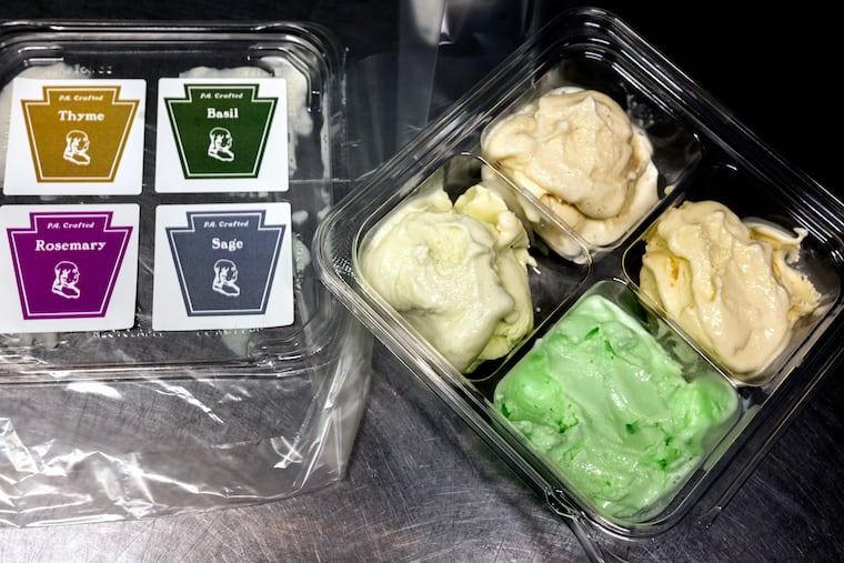 A limited-edition flight of four herb-infused ice creams that will be sold in August at Franklin Fountain as part of the shop's 250th celebrations. Clockwise from top are: thyme, basil, sage, and rosemary.