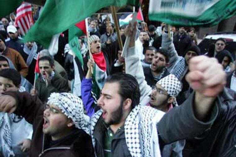 Ehmud Ibrahim protests against Israeli attacks in Gaza at a rally in Center City on Tuesday. (David Swanson / Staff Photographer)