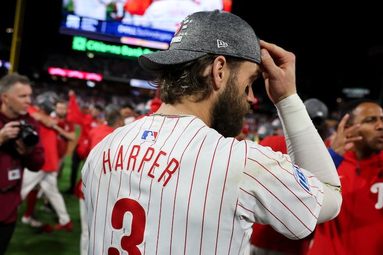 Bryce Harper celebrates a first for him in a Phillies uniform — winning the NL East.