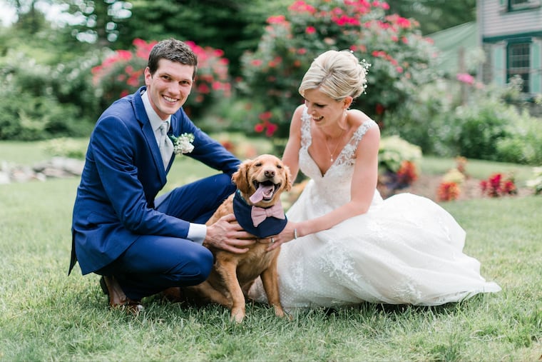Scott Derkacz, Chelsea Miles and dog Finn.