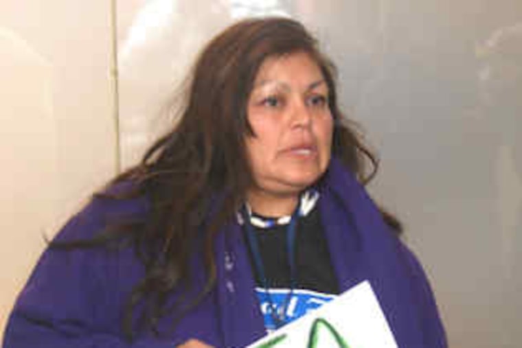 Commuter Tila Ayala of Philadelphia protests the SEPTA strike. She was at Suburban Station during rush hour Friday.