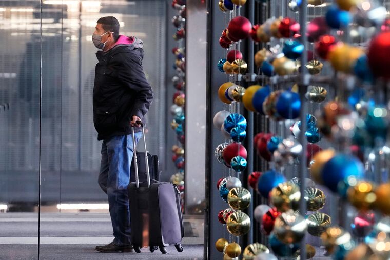 A traveler walks in Terminal 3 at O'Hare International Airport in Chicago on Monday.