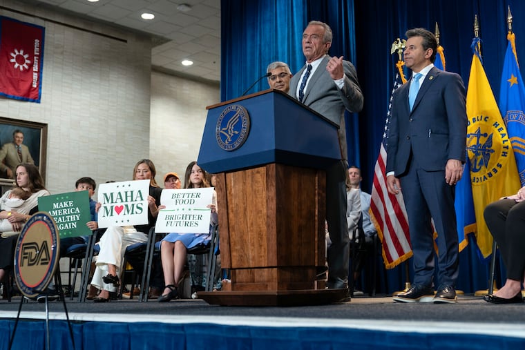 Health and Human Services Secretary Robert F. Kennedy Jr. flanked by Director of the National Institutes of Health Jay Bhattacharya (left) and Food and Drug Administration commissioner Marty Makary in April. (AP Photo/Jose Luis Magana)