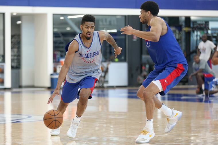 Cincinnati guard-forward Jacob Evans, left, drives past Missouir forward Jordan Barnett during a pre-draft workout at the Sixers Training Complex in Camden, N.J., on Friday, June 15, 2018. TIM TAI / Staff Photographer