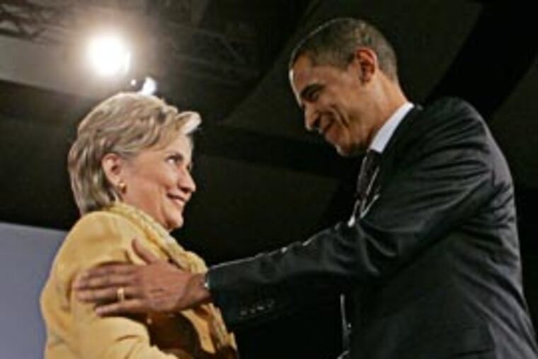 Democratic presidential hopefuls, Sen. Barack Obama, D-Ill., right, and Sen. Hillary Rodham Clinton, D-N.Y., shake hands at the Compassion Forum held at Messiah College in Grantham, Pa., Sunday. (AP)