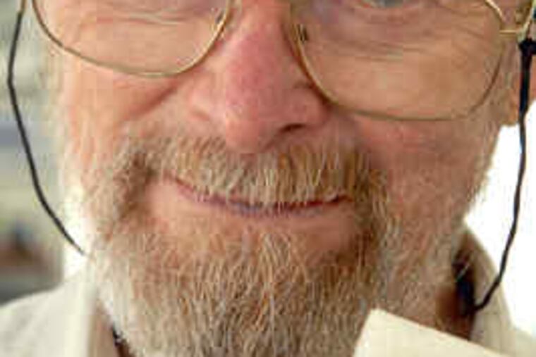 George E. Smith shows the first "charge-coupled device" from 1969 after he dug it out of a box at his home yesterday.