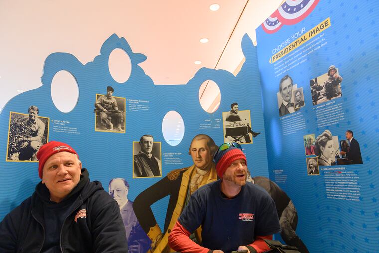 Andy Godown (left) and Brian Burns of Trenton, N.J., speak their opinion on the impeachment of President Donald Trump at the Constitution Center in Philadelphia, Dec. 18, 2019.