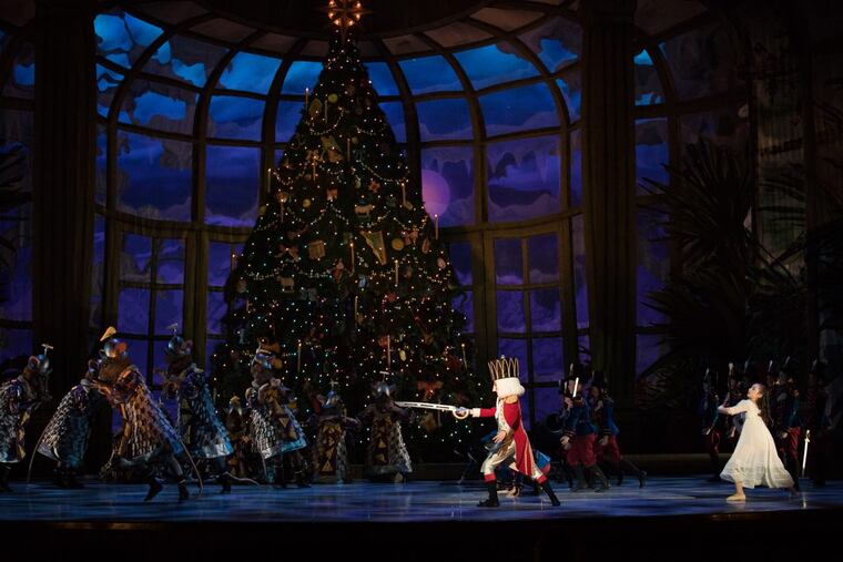 Ava DiEmedio, as Marie, tries to help the Graham Wissinger, as the Nutcracker Prince, win the battle against the mice in "George Balanchine's The Nutcracker."