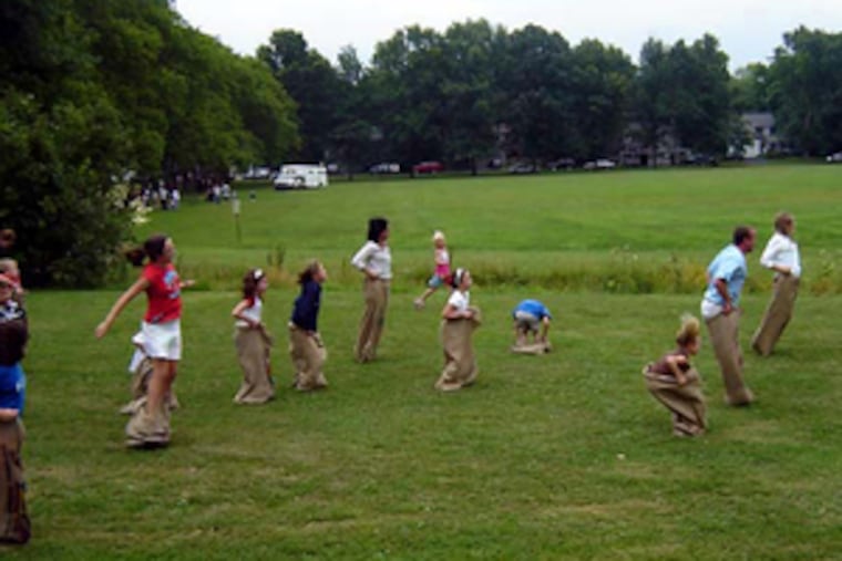 The great sack race at the Fourth of July celebration at Fonthill Museum, Doylestown, was one event photographed by Raymond Varisco. He visited several this summer with wife Susan.