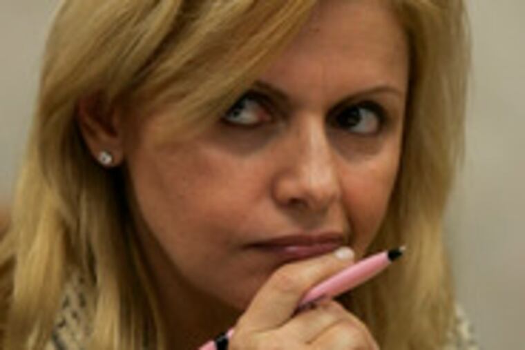 Dina Matos McGreevey listens to testimony.