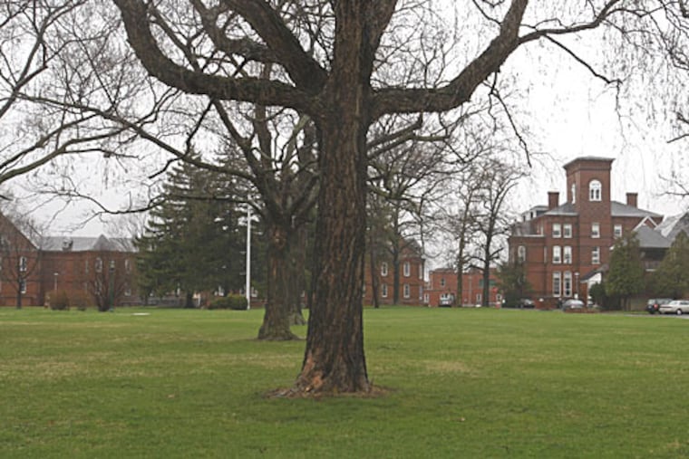Norristown State Hospital's administration building is shown at right. The hospital's staff were recently cited by state investigators looking into safety lapses after a patient there killed his roommate in July.