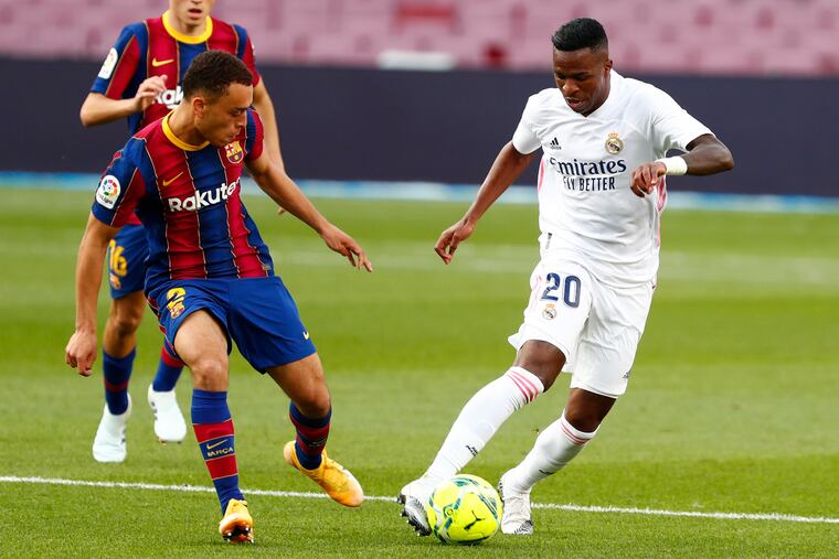 Sergiño Dest, left, on Saturday became the first American to ever play in the famous Barcelona-Real Madrid rivalry game.
