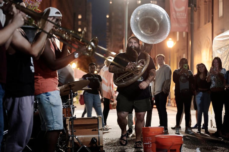 Sousaphone player Sam Gellerstein and the rest of Snacktime perform in Rittenhouse Square.