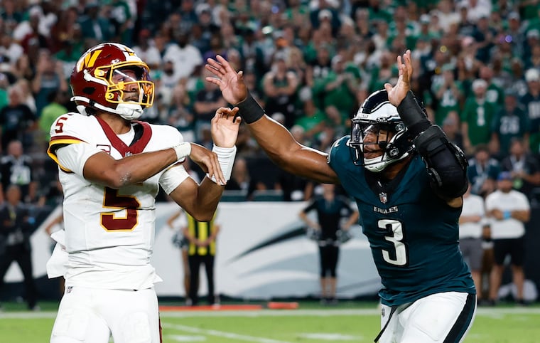 Nolan Smith (right) generated six pressures against the Commanders.