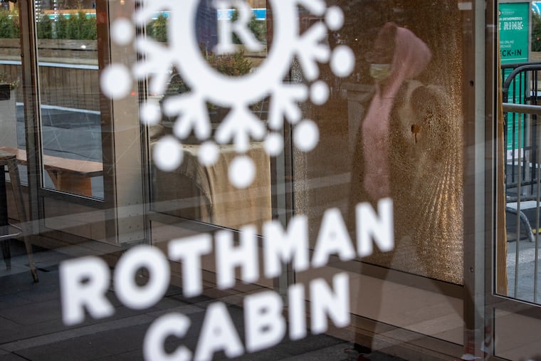 A bullet hole in the glass at the Rothman Cabin at Dilworth Park on the west side apron of Philadelphia City Hall on Tuesday morning. Police say a man shot twice at a security guard after being asked to leave the park.