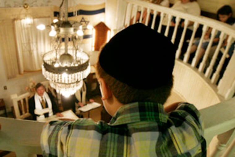 Beth Israel, a tiny synagogue founded in Rosenhayn, N.J., in the 19th century, opens once a year. Above, Ben Bleefeld, 8, watches his grandfather, Rabbi Bradley Bleefeld, from the balcony.