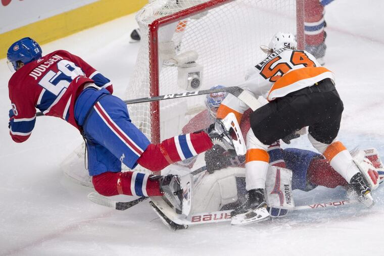 Montreal Canadiens defenseman Noah Juulsen and Flyers left winger Oskar Lindblom run into Montreal goaltender Charlie Lindgren during the second period on Monday.