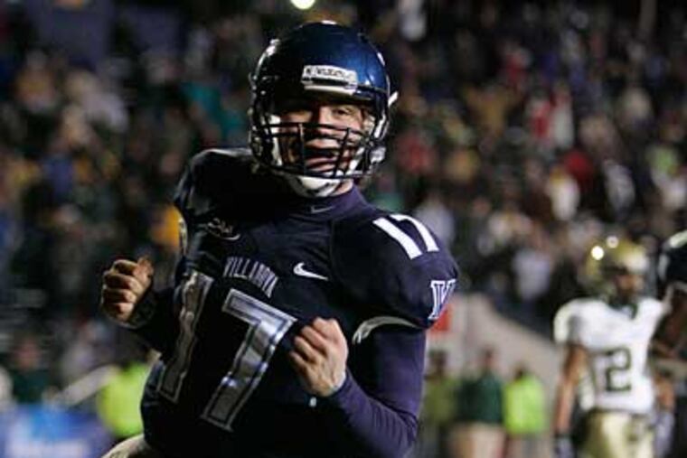 QB Chris Whitney scores on a keeper in the fourth. ( David Swanson / Staff Photographer )