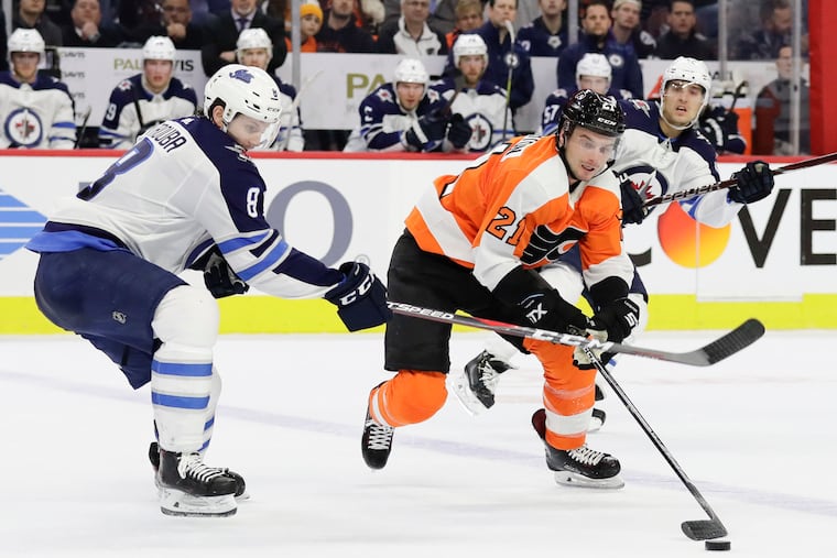 Winnipeg's Jacob Trouba, shown defending against the Flyers' Scott Laughton last season, was dealt to the New York Rangers on Monday.